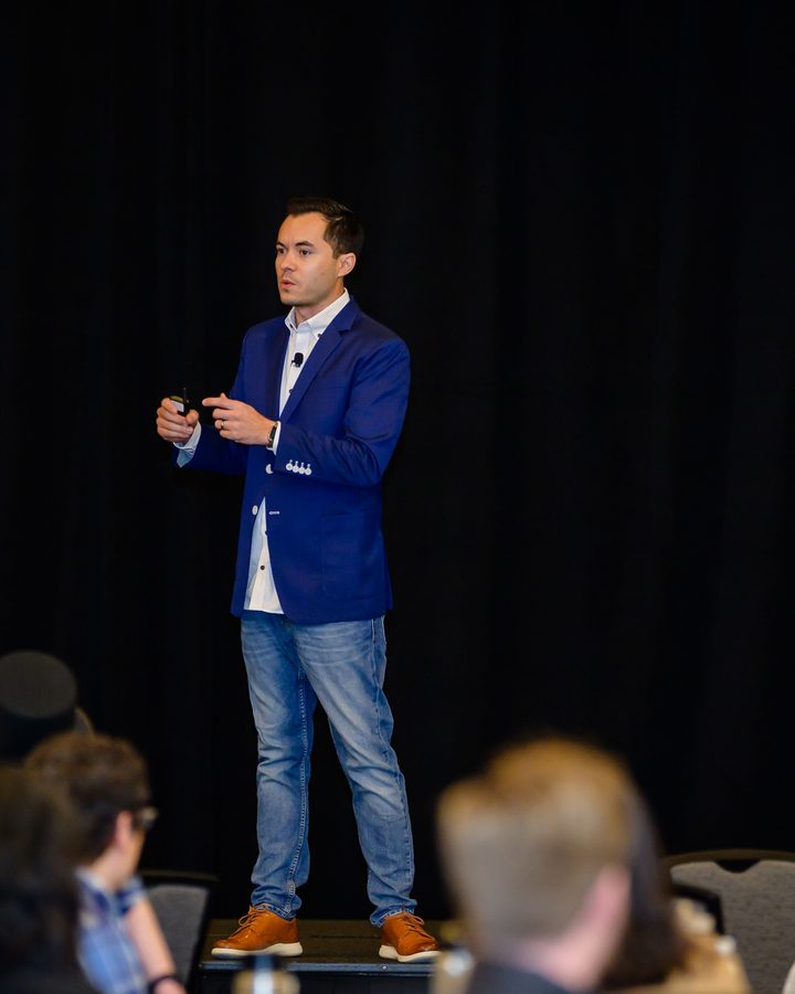 Ryan Vet speaking on stage
