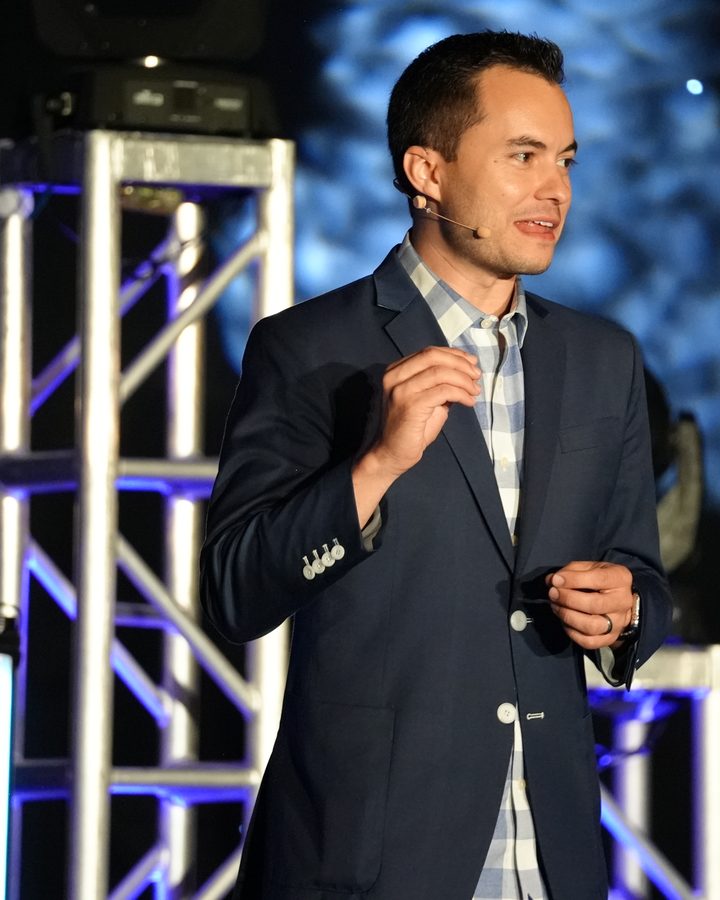 Ryan Vet speaking on stage